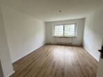 Über wenige Stufen in Ihr neues Zuhause im Erdgeschoss! - Wohnzimmer